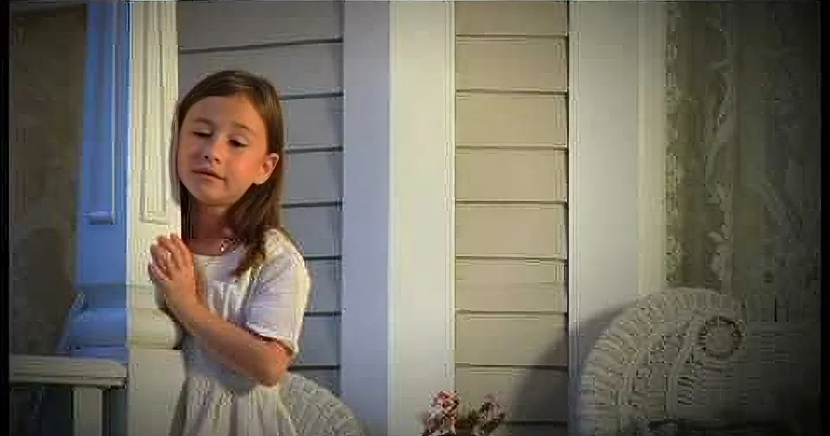 A young girl in a white dress prays with hands clasped, surrounded by a collage of similar images.