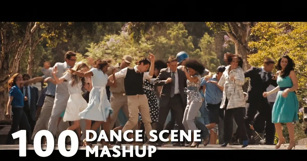 A group of people dancing energetically in a park setting.