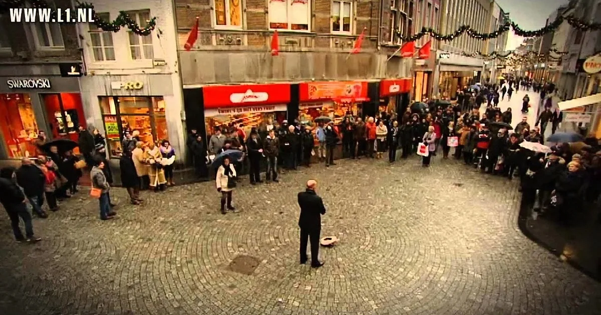 A Crowd Stands in Awe in the Netherlands When This Busker Tosses His Hat on the Ground
