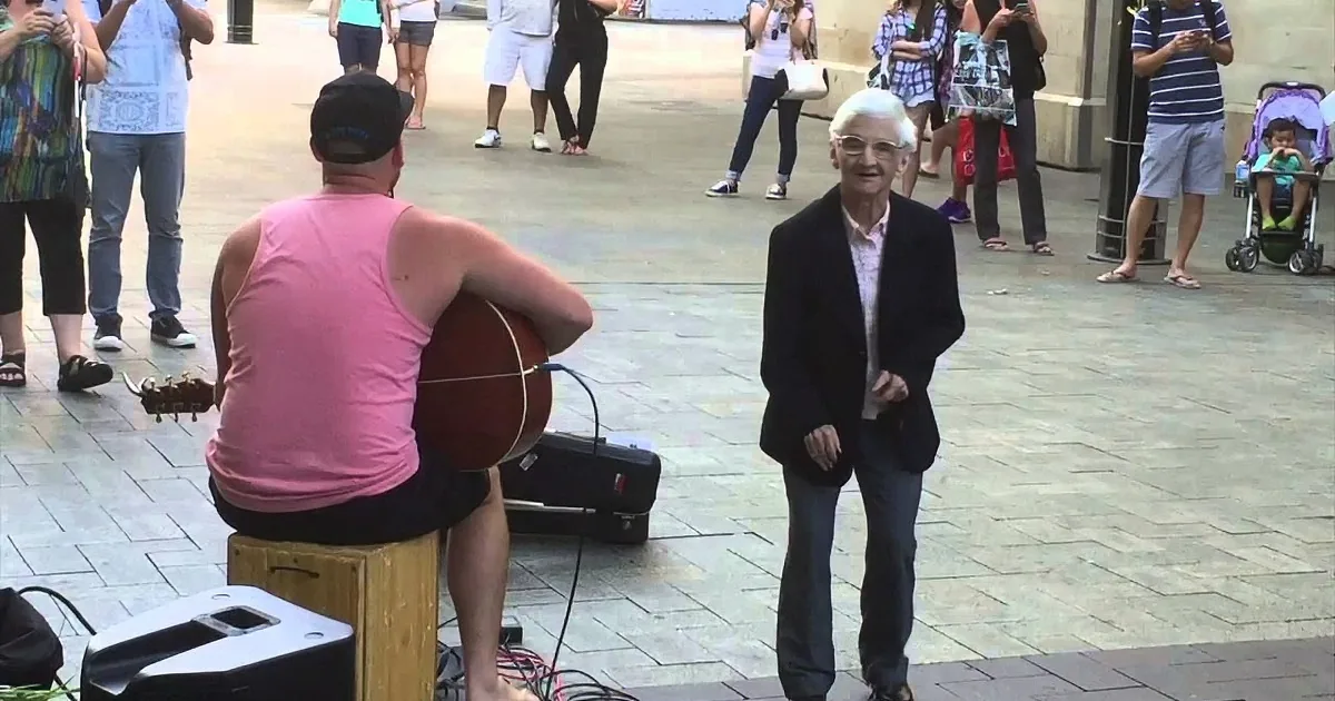 When This Street Performer Started Playing ''Superman'', This Energetic Grandma Couldn''t Resist!