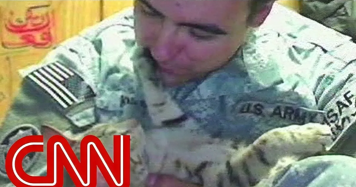 A soldier in a military uniform is shown in a close-up, with the CNN logo visible in the foreground.