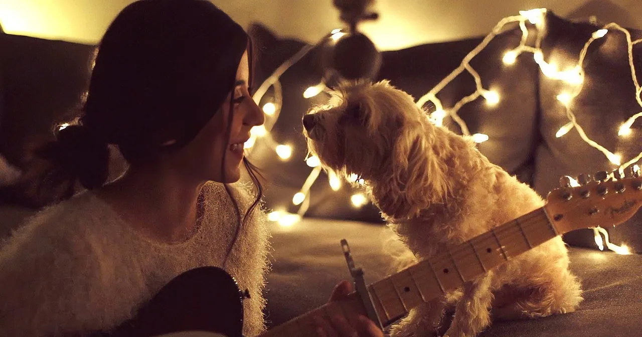 When She Starts Singing a Christmas Song, Her Dog Has the Cutest Reaction
