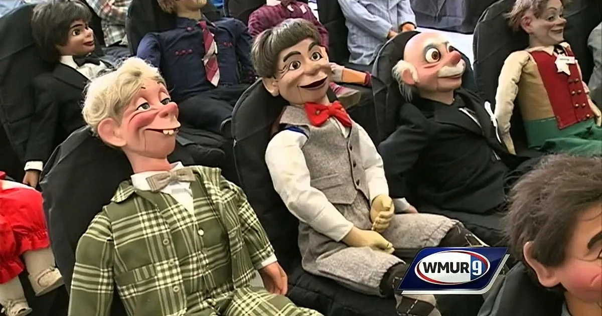 Puppet characters in formal attire sit together, appearing to watch an event.