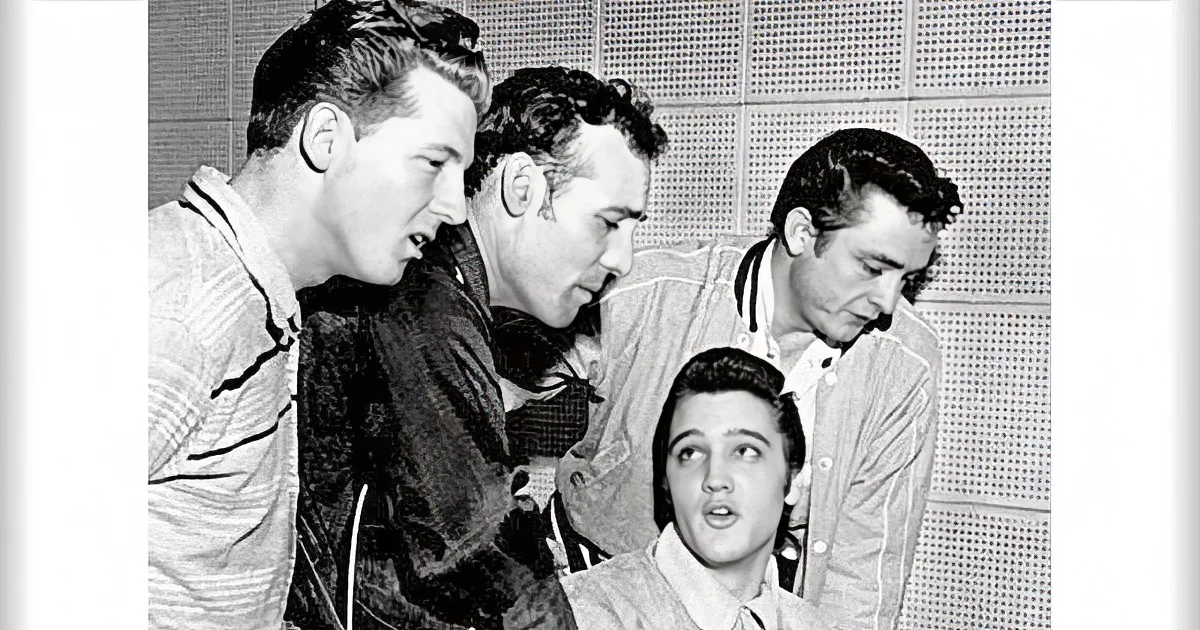 A group of men in a room, one appears to be speaking, others listening intently.