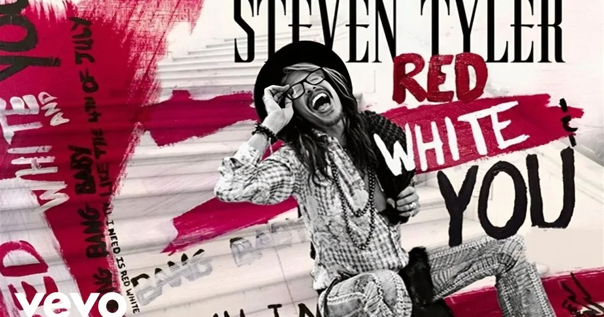 Steven Tyler, in a plaid shirt, poses with a vibrant red and white background, promoting his song "Red White & You."