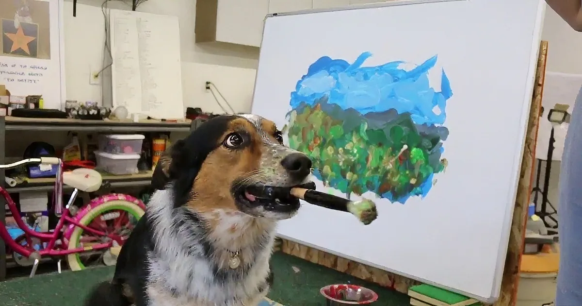 A dog wearing a harness stands in front of a whiteboard with a paintbrush, seemingly painting a landscape.
