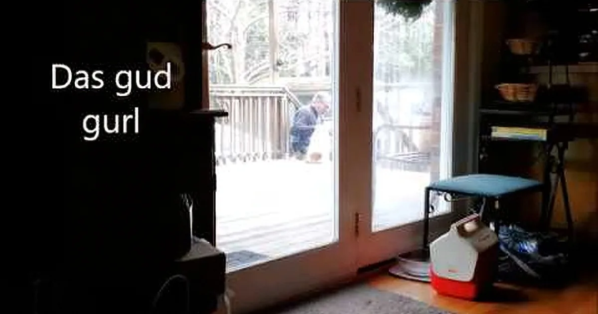 A person walks out of a house through a glass door, with text "Das gud gurl" on the left.