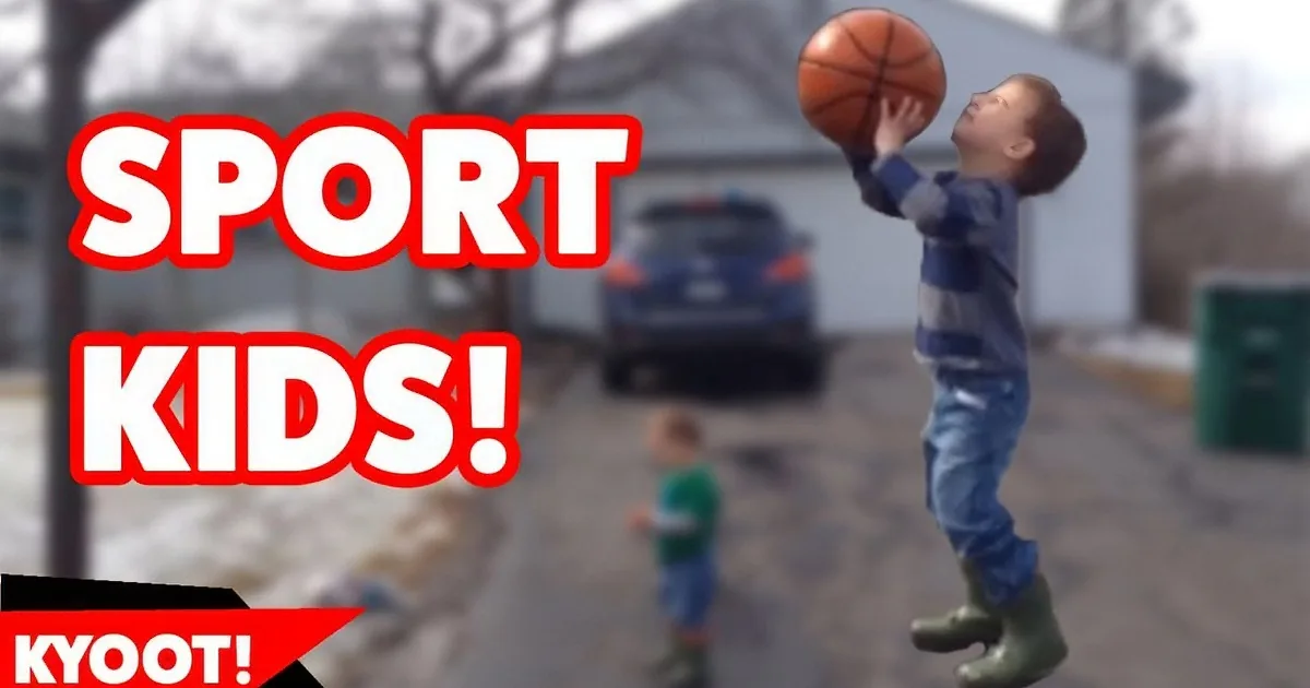 A young boy jumps to dunk a basketball in a suburban driveway.