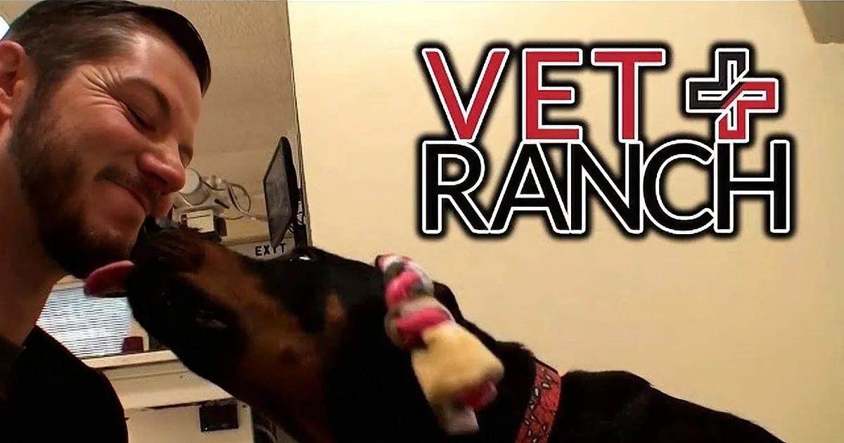 A man smiles as a dog licks his face, with a "VET RANCH" logo in the background.