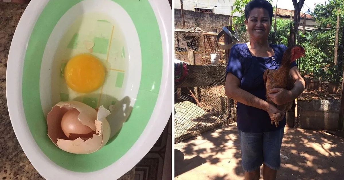 A woman holds a chicken, smiling, while a cracked egg sits in a bowl nearby.