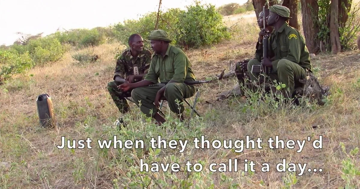 Three men in green uniforms squat in a grassy field, holding weapons, with a caption about calling it a day.