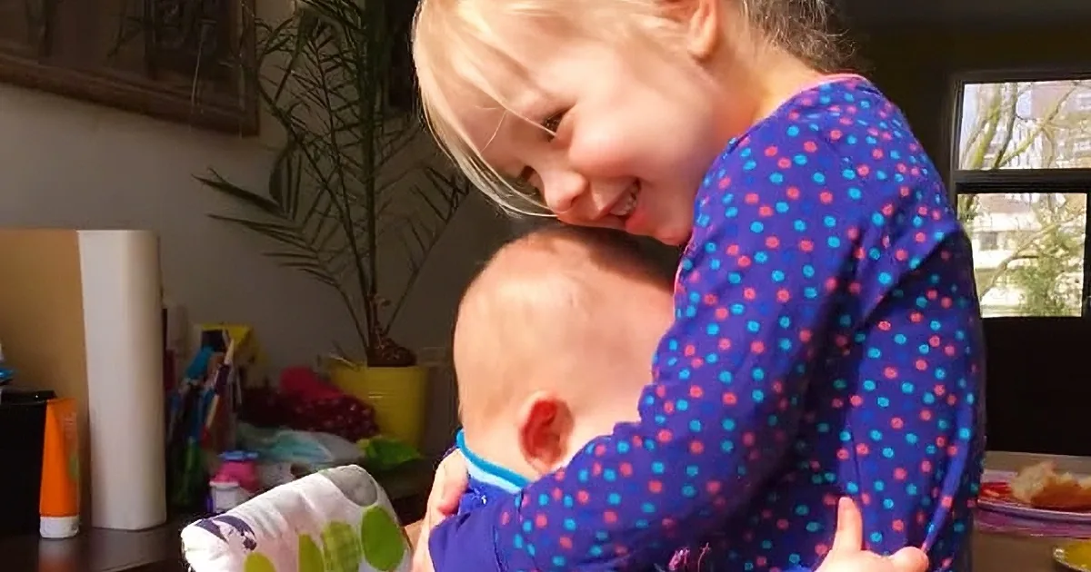 Your Heart Will Melt When You See How Sweetly This Baby Cuddles With Her Sister