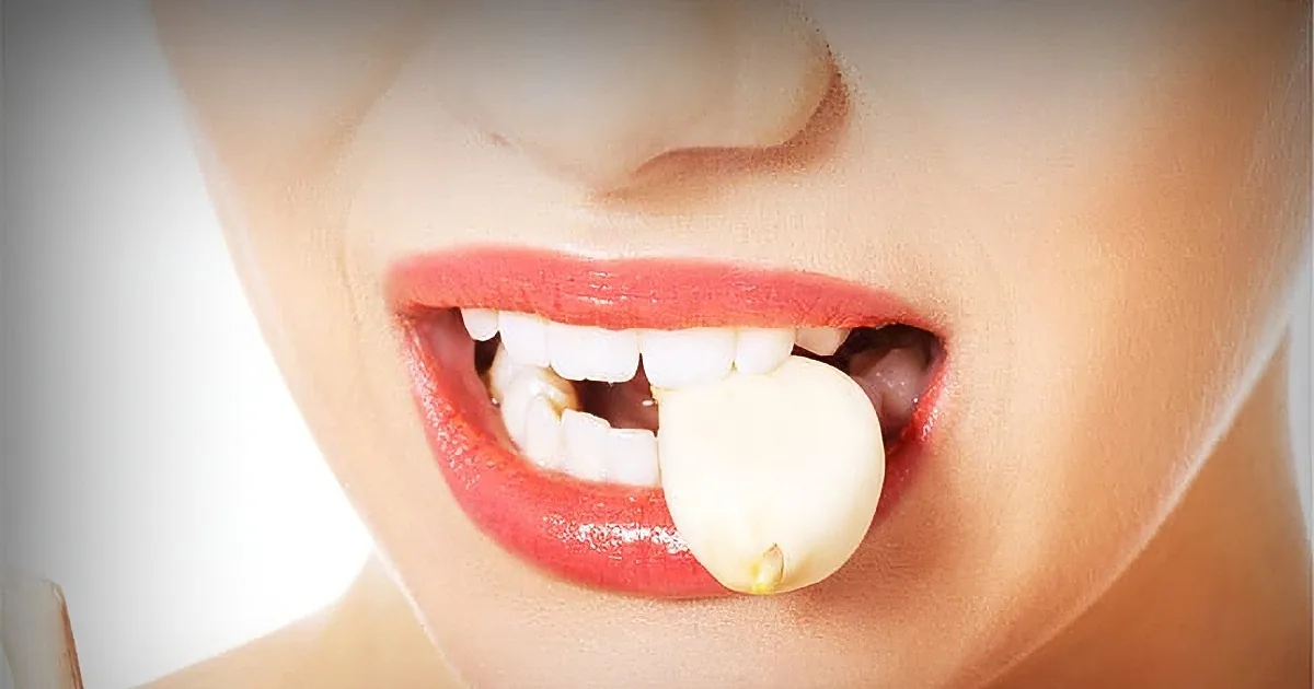 A close-up of a person's mouth with a missing tooth, showing a gap and surrounding teeth.