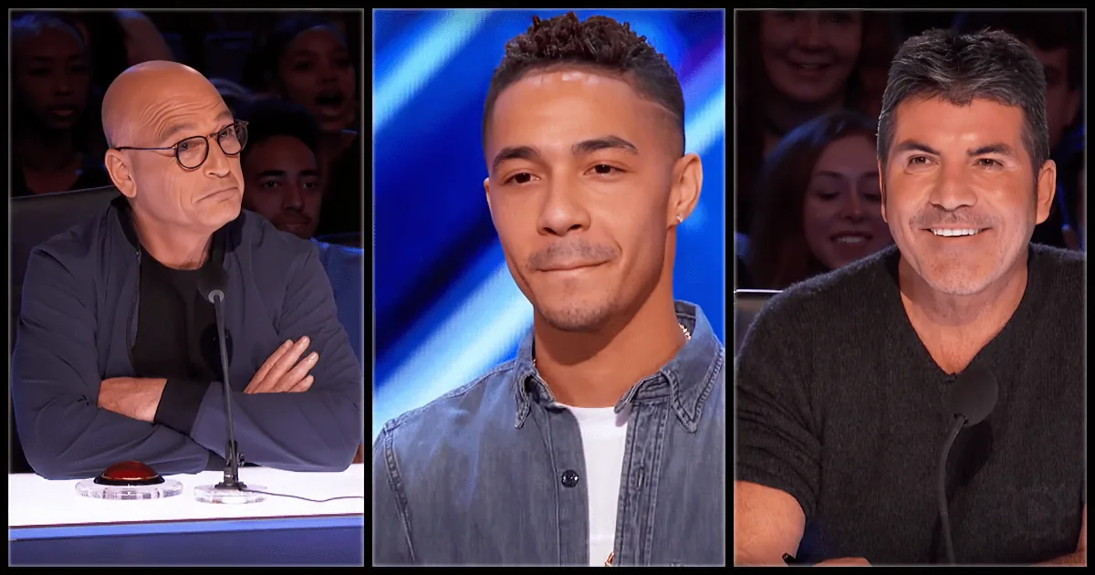 A young man in a denim shirt stands between two judges, one with a serious expression and the other smiling.