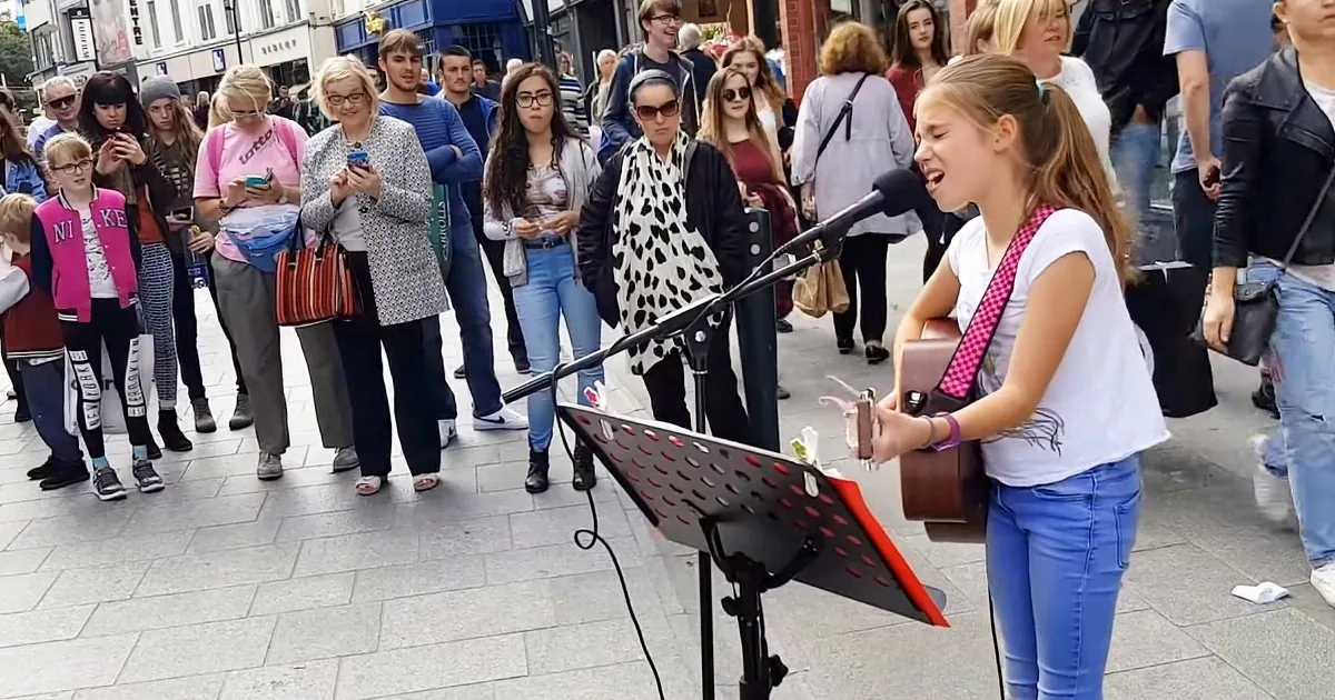 A Star Is Born: 11-Year-Old Street Musician Stuns Crowd With Her Unique Voice