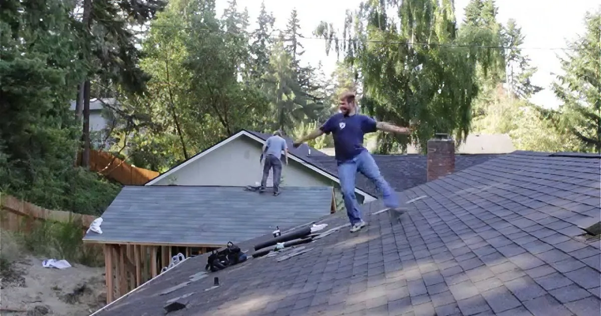 Two Hard-Working Roofers Can''t Help but Move to the Beat When the Music Starts Playing