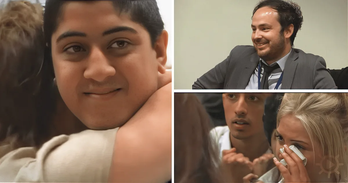 A man in a suit smiles, while another man hugs someone, and a woman wipes her face in the background.