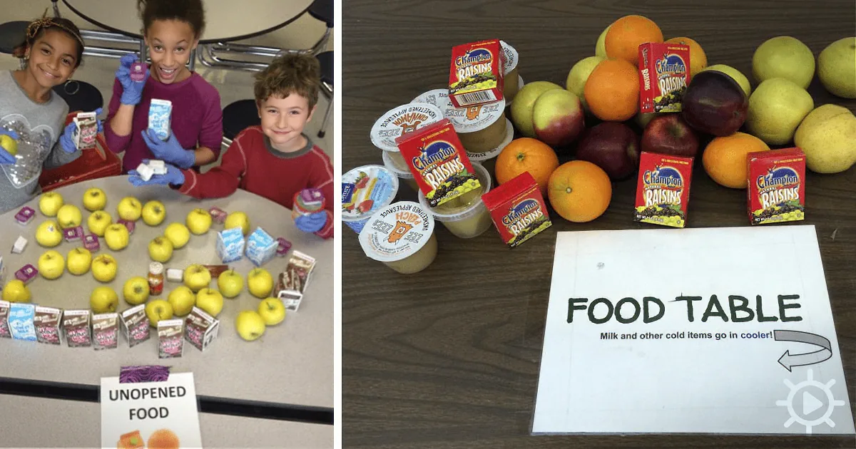 Children arrange unopened food items on a table with a sign directing where to put cold items.