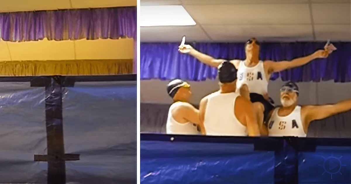 Swimmers in white USA uniforms celebrate victory with arms raised, standing on a platform.