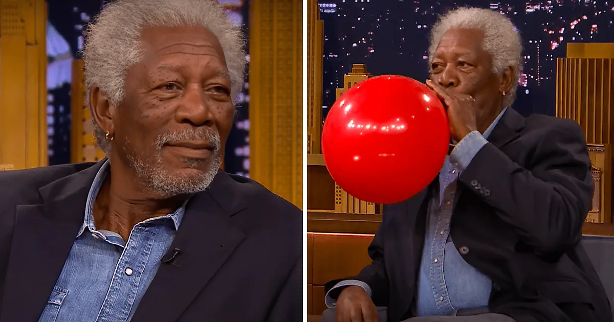 Morgan Freeman and Jimmy Fallon are seated on a talk show set with a cityscape backdrop.