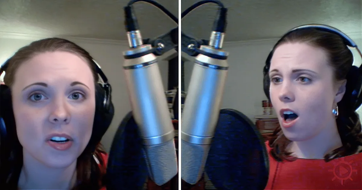 A woman wearing headphones and speaking into a microphone, with a surprised expression.