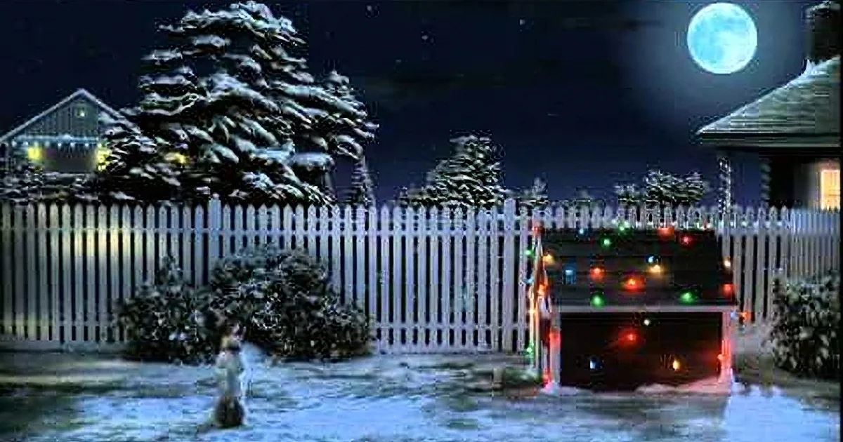 A child stands in a snowy yard under a full moon, surrounded by decorated houses and trees.
