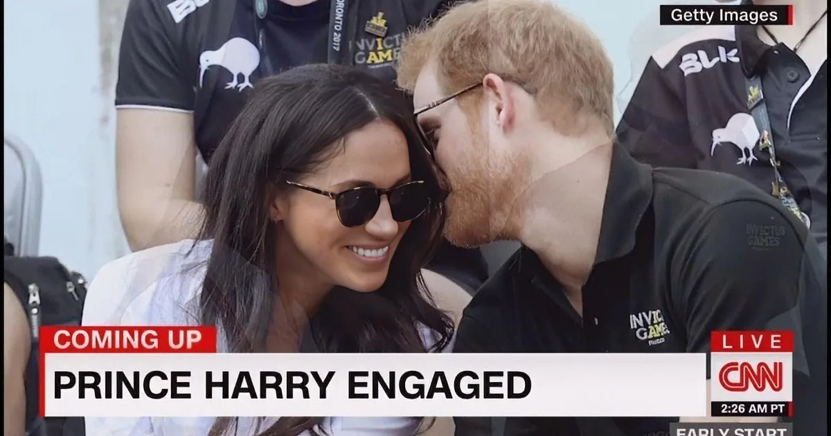 Prince Harry kisses Meghan Markle, both wearing Invictus Games attire, as CNN announces their engagement.