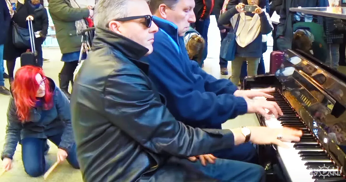 2 Guys Play the Piano at a Train Station. Then, a Woman Joins Them for an Epic Performance.