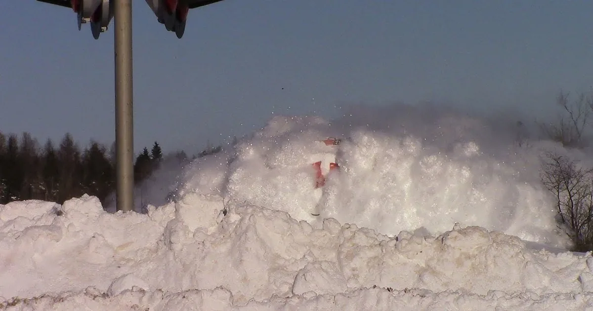 Man Records Train Speeding Down Tracks and Captures Moment It Demolishes a Wall of Snow