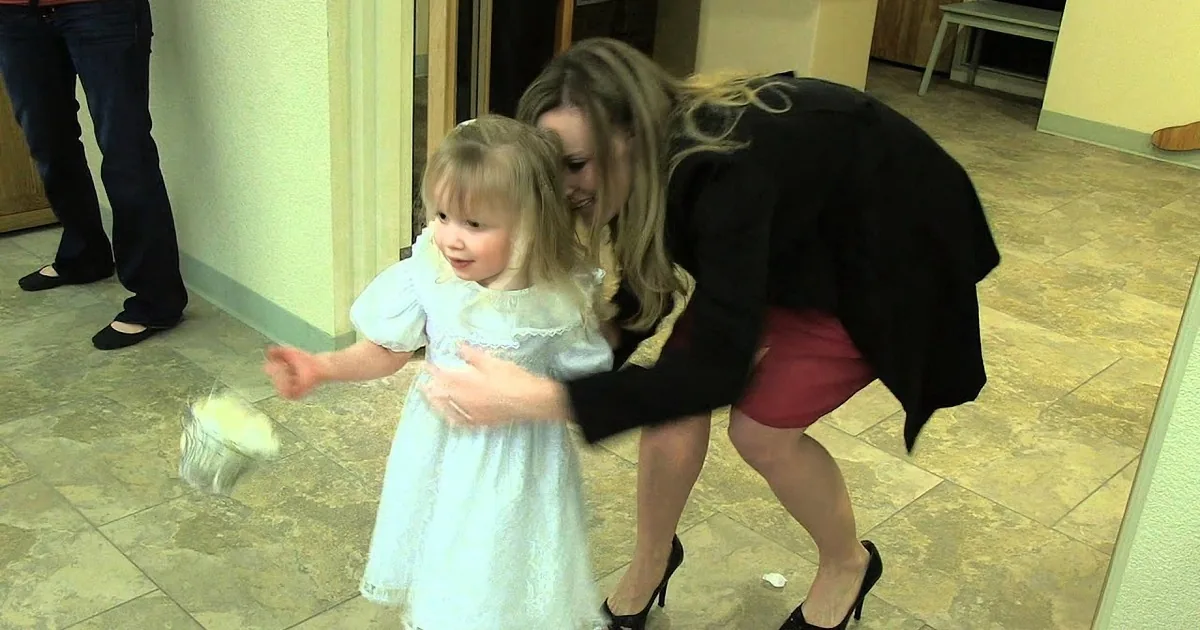 Cute-as-a-Button Flower Girl Scared to Walk Down Aisle, Crowd in Hysterics When Groomsman Saves the Day