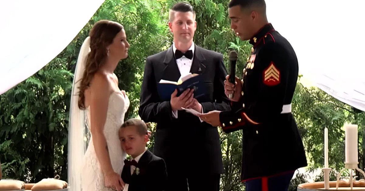 A bride and groom exchange vows at a wedding ceremony, surrounded by family and friends.