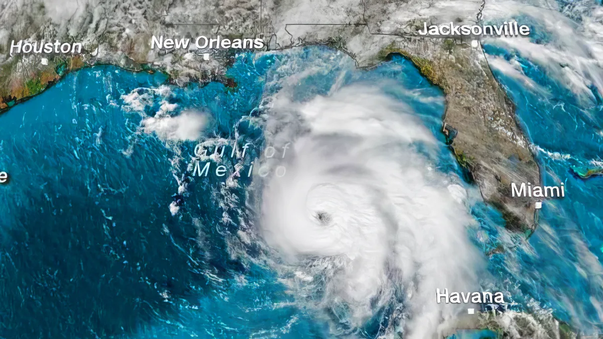 A satellite image shows a hurricane with a well-defined eye over the Gulf of Mexico, near Florida.