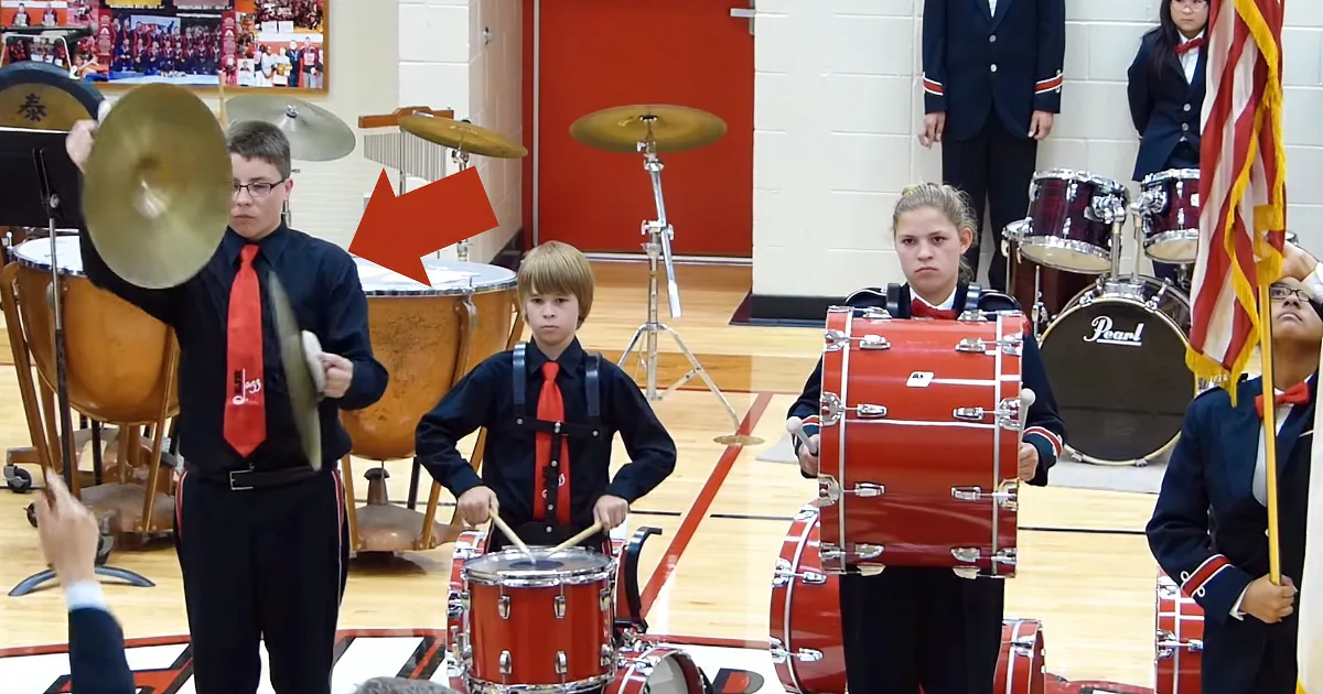 Boy drops cymbal while playing national anthem