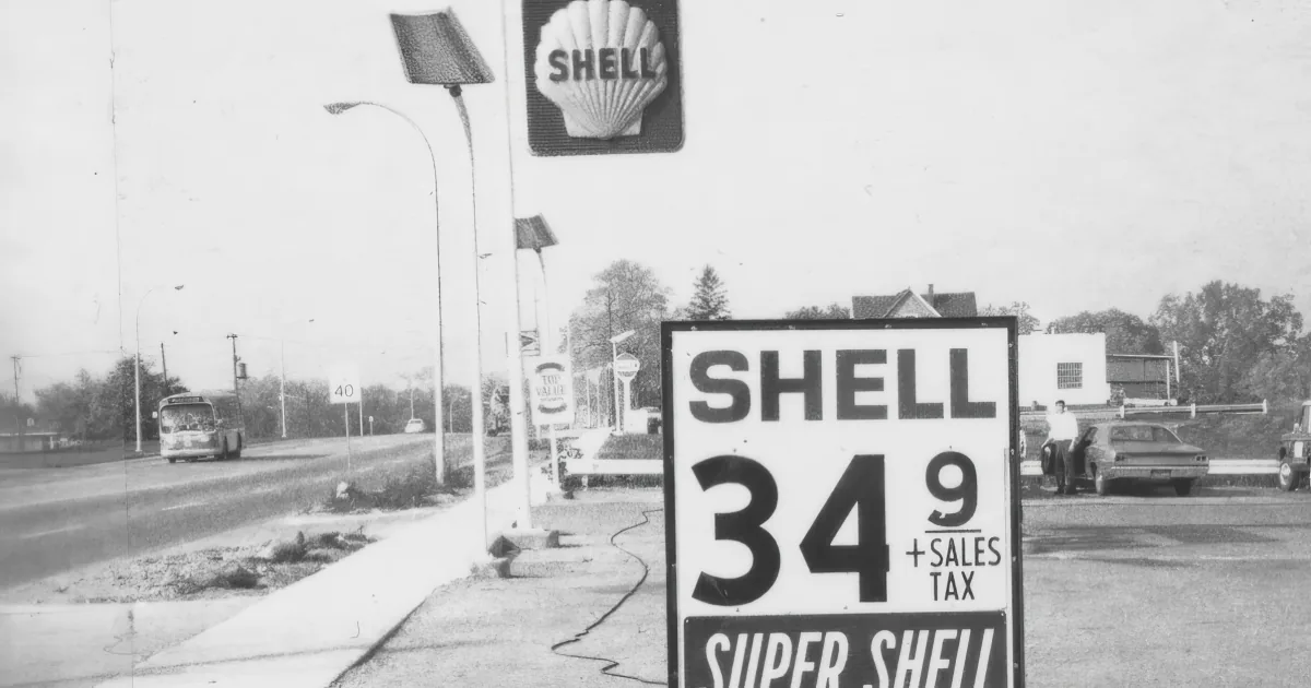 A Shell gas station sign displays fuel price of 34.9 cents per gallon with sales tax.