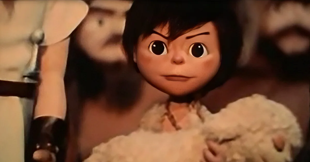 A close-up of an animated character holding a fluffy object, with another figure in the background.