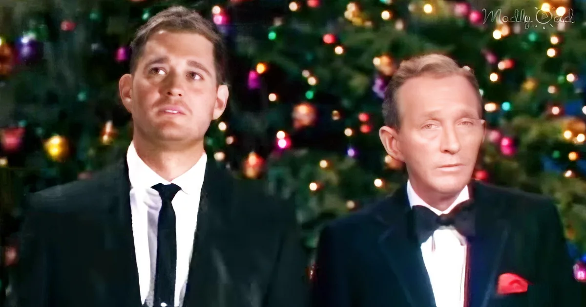 Two men in formal attire stand in front of a decorated Christmas tree.