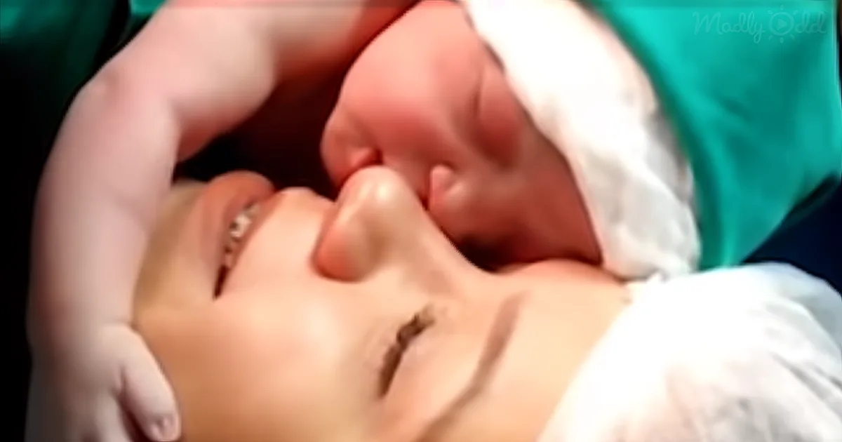 Baby holds on to mom