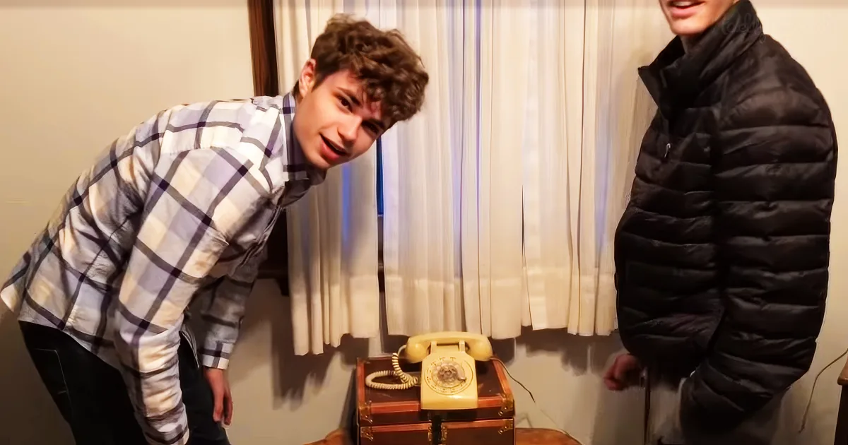 Teens try to use rotary phone