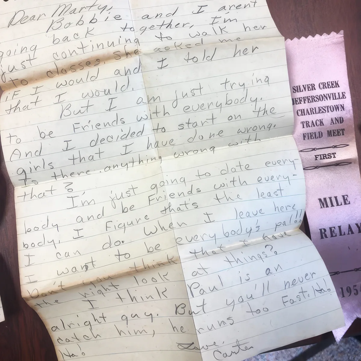 A handwritten letter addressed to Marty discusses a breakup and friendship, mentioning Bobbie, Paul, and a track and...