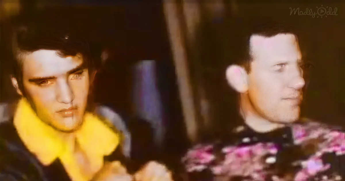 Elvis Presley in a yellow shirt and another man in a patterned suit are seated, possibly in a studio setting.