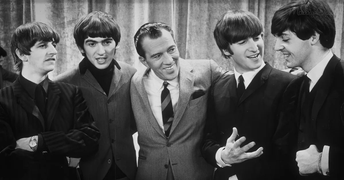 The Beatles and Ed Sullivan share a moment of laughter and camaraderie during their historic 1964 appearance.