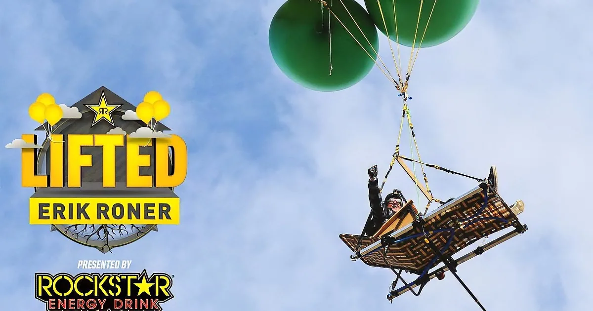 A person is suspended in the air by green balloons, riding a makeshift platform, with "LIFTED" and "Rockstar Energy...