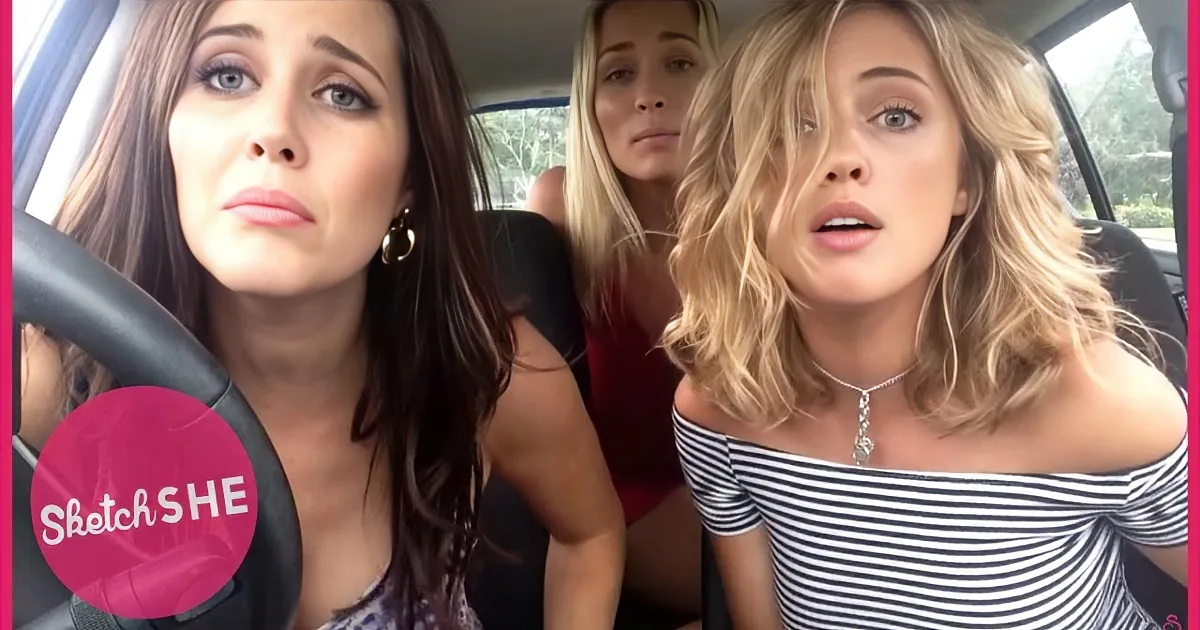 Three women in a car, one driving, two passengers, one in striped top, another in red, with "Sketch SHE" logo.