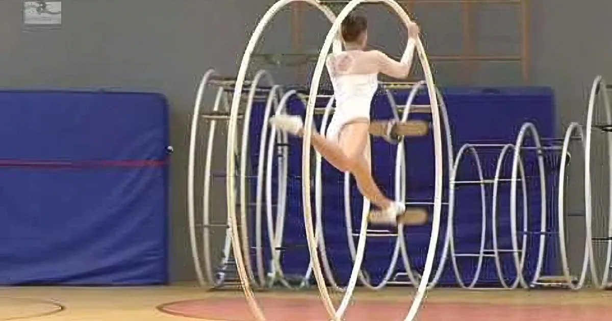 As Soon as the Music Starts, This Girl Reaches up to These Two Hoops and Does This. Mind Blowing...