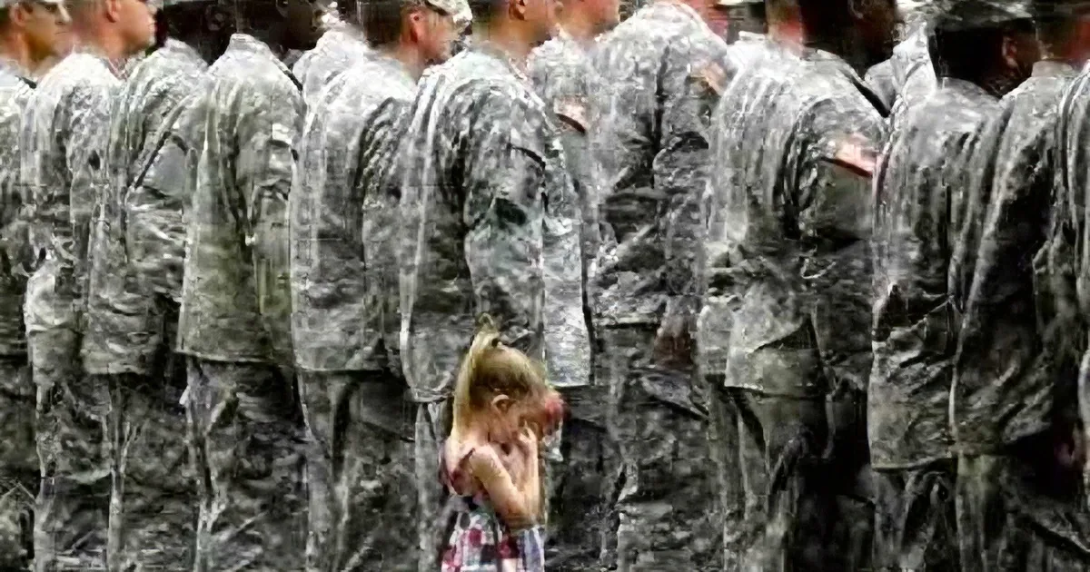 A young girl sits alone, surrounded by rows of soldiers in uniform, appearing contemplative.
