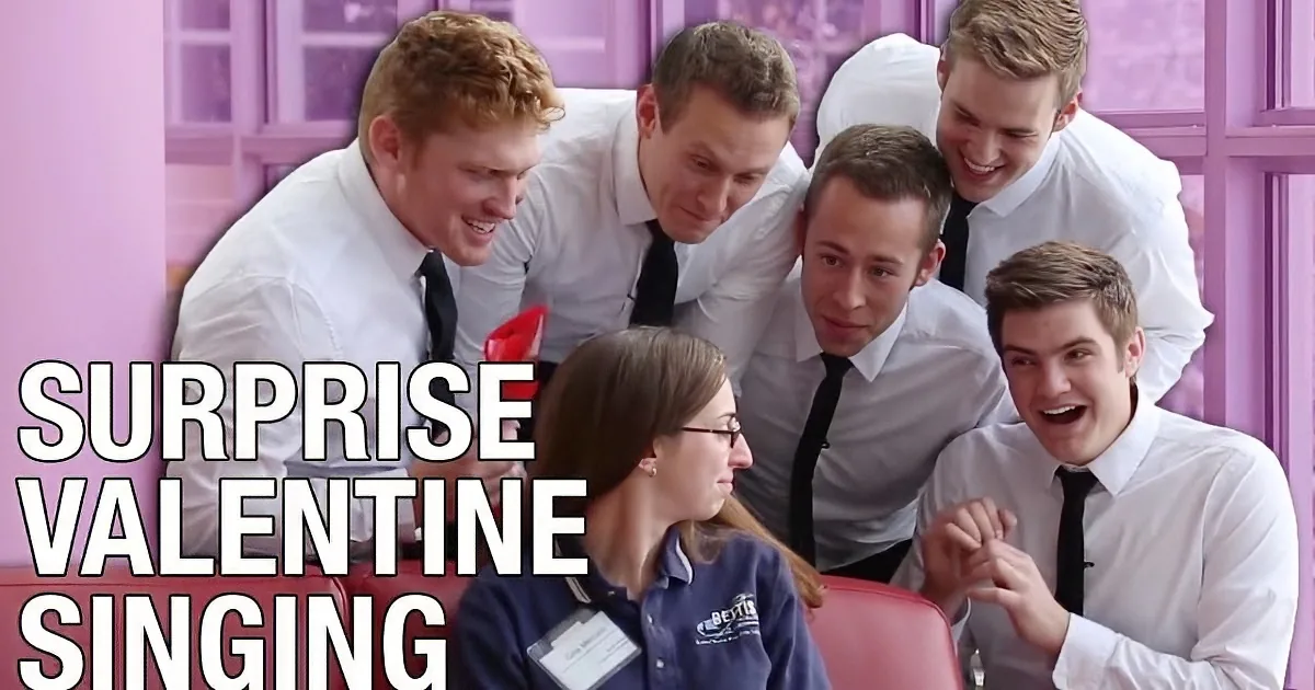 A group of men in white shirts and ties surprises a woman with a Valentine's Day singing performance.