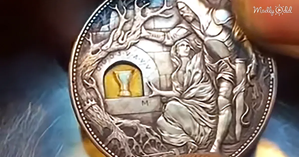 A detailed coin featuring a woman under a tree with a chalice in a niche.