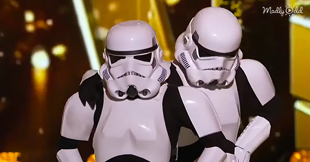 Two Stormtroopers in white and black uniforms stand side by side, facing forward.