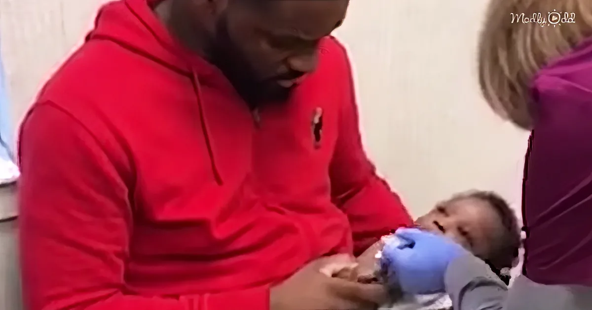 This Dad's Technique for Comforting His Baby Getting Shots Is Adorable