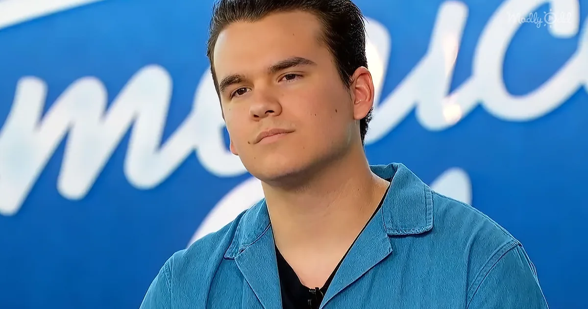A person in a blue shirt stands in front of a blue background with white text.
